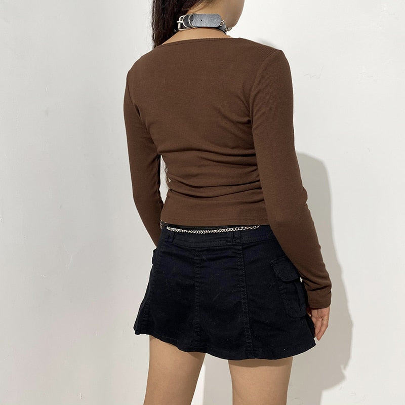 TOP CROP GRUNGE CON PEDRERÍA